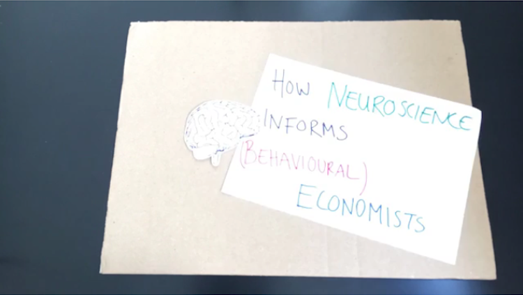 how neuroscience informs (behavioural) economists written in marker next to a cutout brain