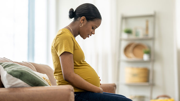 Pregnant woman sitting down