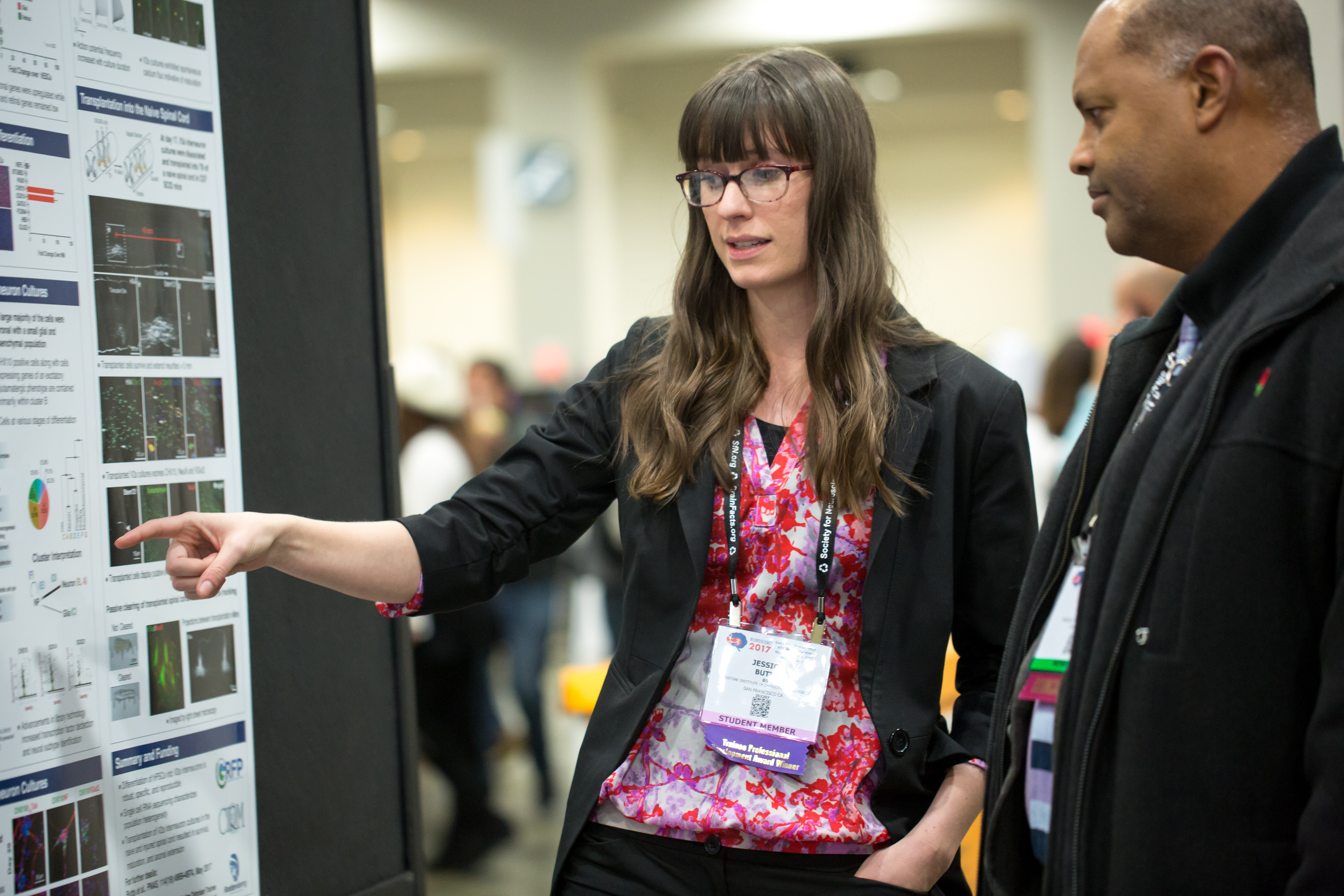 Woman presenting her poster